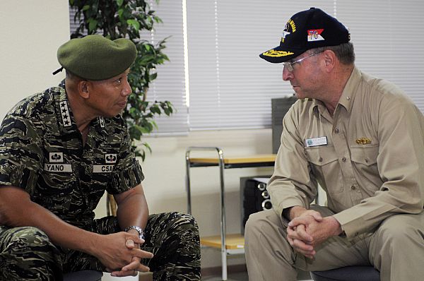 Armed Forces of the Philippines (AFP) Chief of Staff Gen. Alexander B. Yano and Rear Adm. James P. Wisecup, commander, Carrier Strike Group (CSG) 7, discuss the progress and plans for future clean up efforts of the Philippines.