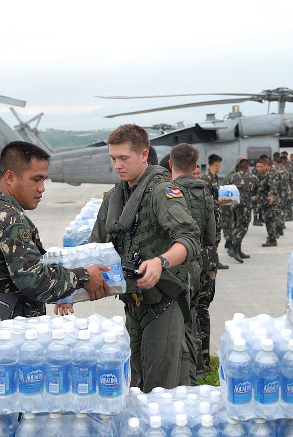 Service members assigned to the Philippine Army and Sailors assigned to the 