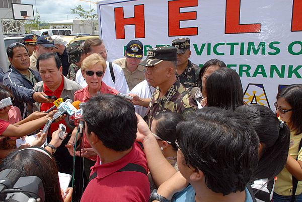 U.S. Ambassador to the Philippines, Kristie A. Kenney, speaks with members from the Philippine media. Kenney, Commander Carrier Strike Group Seven, Rear Adm. James P. Wisecup, Armed Forces of the Philippines Chief of Staff, General Alexander B. Yano and Republic of Philippines Senator Dick Gordon, and other American and Philippine officials, met at Iloilo Airport to share their goals and show their support for Typhoon Fengshen relief efforts.